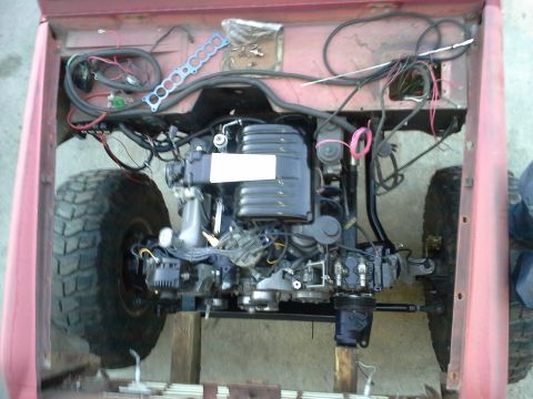 1968 Ford Bronco - Engine and front suspension components are visible in this close-up view of a vehicle's chassis.