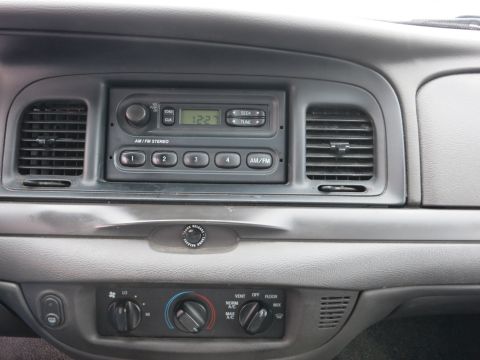 2001 Ford Crown Victoria - Interior view of a 2001 Ford Crown Victoria dashboard, the radio and HVAC controls.