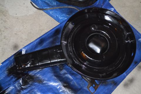 1981 Ford F-250 - A black air cleaner assembly is shown on a blue tarp, possibly after being painted.