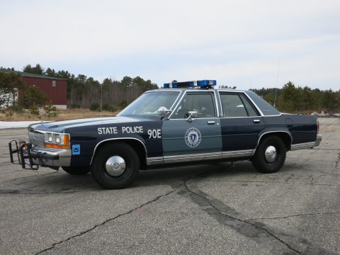 1991 Ford Crown Victoria - Massachusetts State Police car, a 1991 Ford Crown Victoria, is parked outdoors.