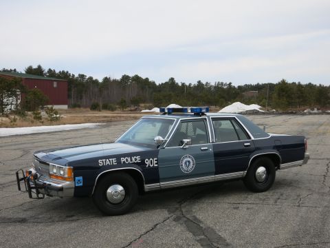 1991 Ford Crown Victoria - Massachusetts State Police Crown Victoria, marked 90E, with blue light bar.