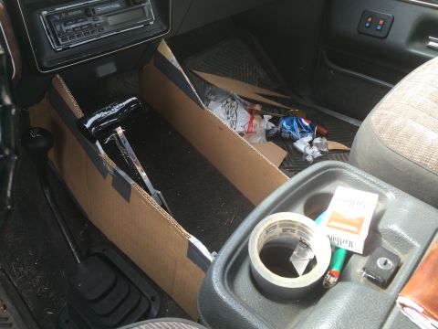 1991 Ford F-150 - Interior view of a 1991 Ford F-150, a cluttered center console and floor.
