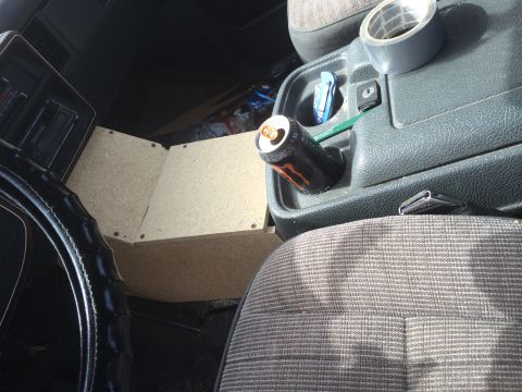 1991 Ford F-150 - The interior of a truck shows a center console with a drink can and a roll of duct tape, suggesting a work-in-progress or utilitarian setup.
