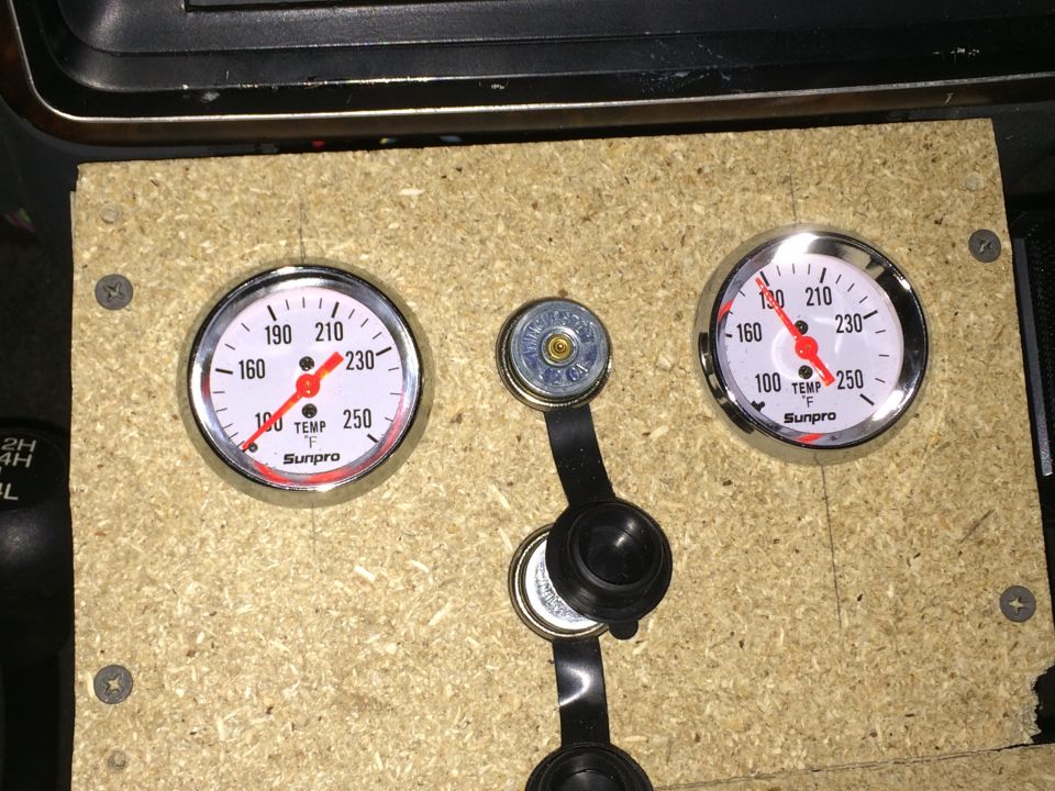 Custom dashboard with two Sunpro gauges and a shifter boot