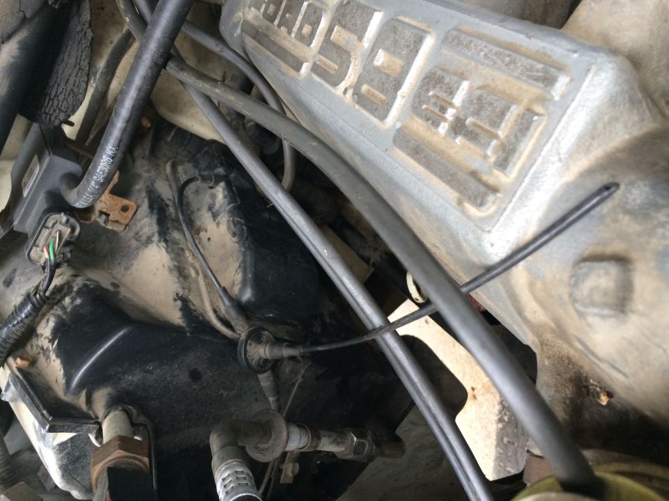 Close-up of a Ford 5.8L engine, likely from a 1991 F-150