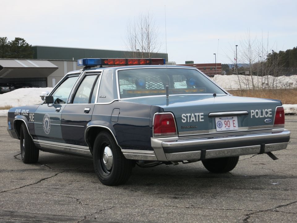 Massachusetts State Police Ford sedan, rear three-quarter showing Ford trunk badge