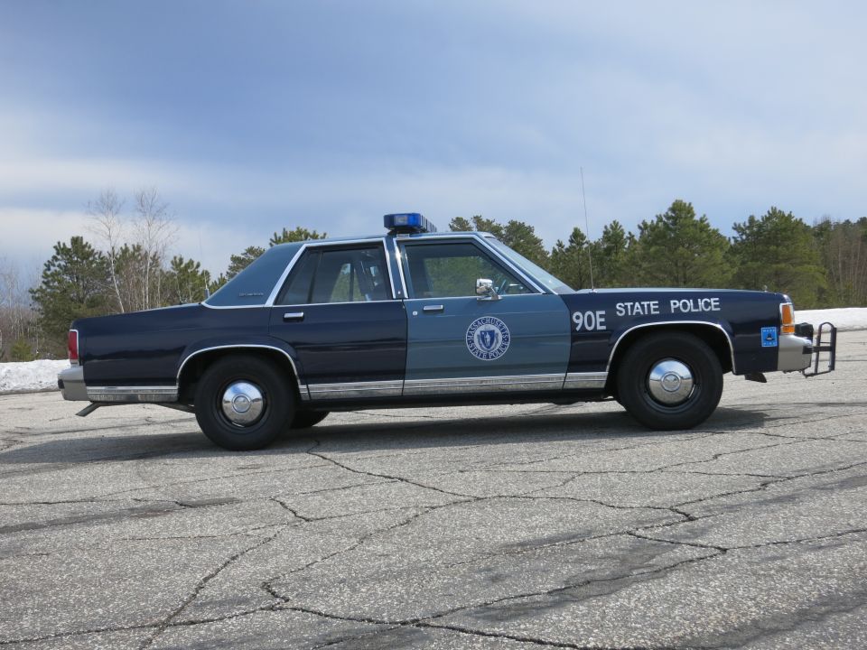 Massachusetts State Police sedan 90E, far-side profile with push bumper