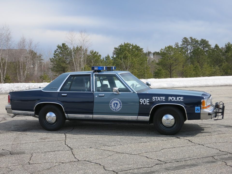 Massachusetts State Police sedan 90E, far-side profile with push bumper