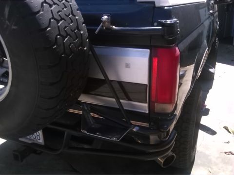 1992 Ford Bronco - Rear view of a 1992 Ford Bronco, showing the spare tire and taillight assembly.