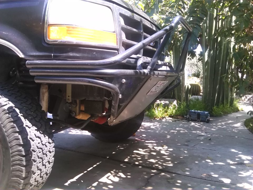 Black 1992 Ford Bronco front end with a custom brush guard and aftermarket bumper