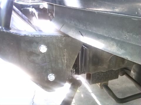 1992 Ford Bronco - Undercarriage view shows structural components and suspension elements of a vehicle.