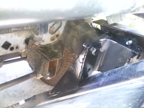 1992 Ford Bronco - A close-up view of a vehicle's engine mount, showing its construction and attachment points.