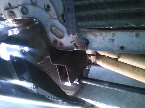 1992 Ford Bronco - Close-up of the vehicle's front end, focusing on the radiator and suspension components.