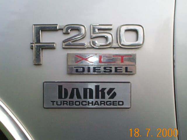 Silver Ford body panel with F250, XLT Diesel, and Banks Turbocharged badges