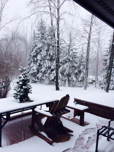 1978 Ford Bronco - A winter scene unfolds with snow blanketing a backyard, outdoor furniture like Adirondack chairs and a picnic table.