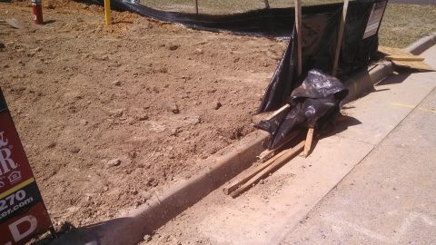 1979 Ford Bronco - A construction site shows disturbed earth and debris, with a logo from Supermotors.net visible.