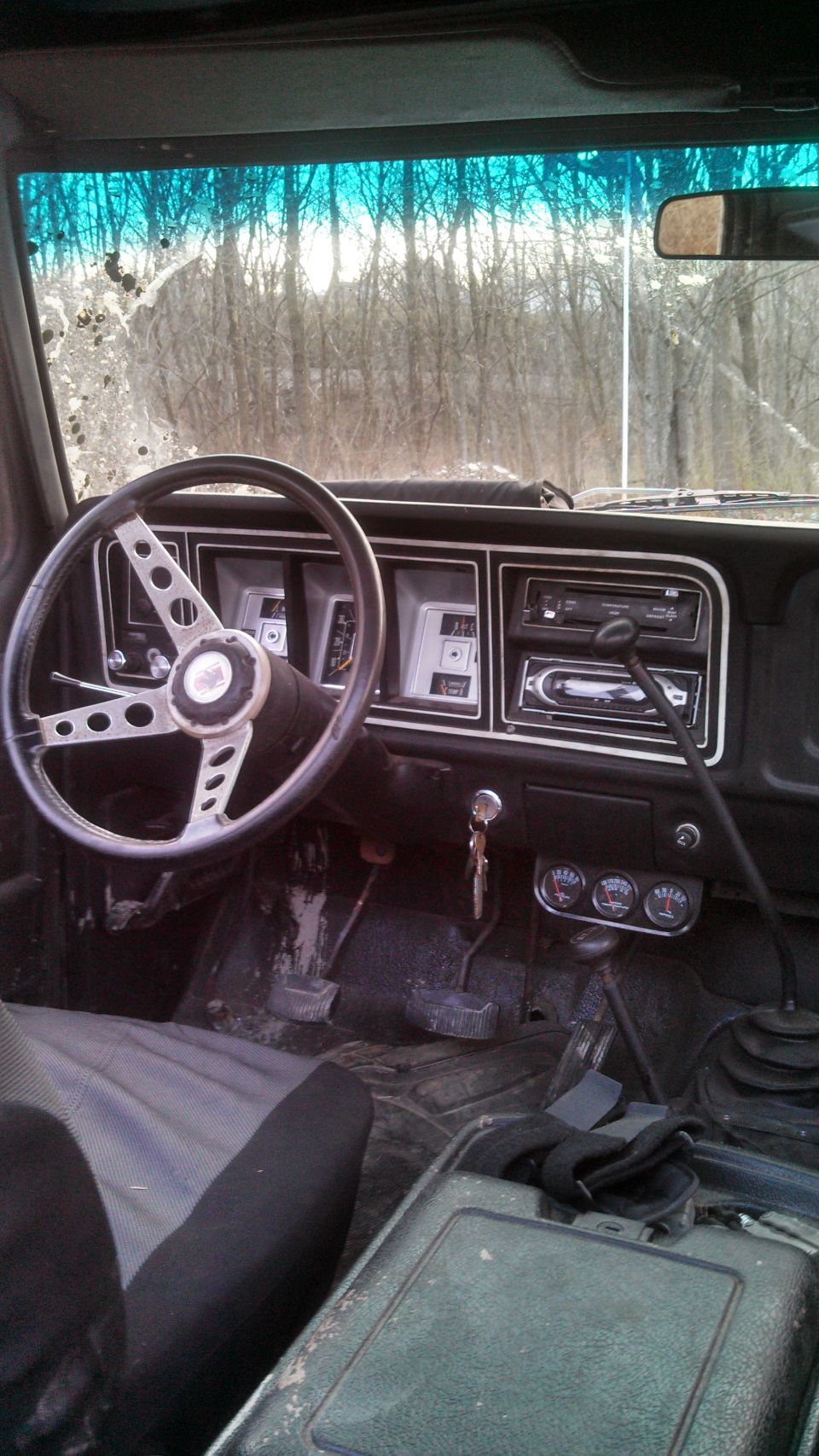 1979 Ford Bronco interior showing dashboard, steering wheel, and center console