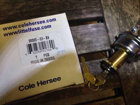 1979 Ford Bronco - Ignition switch and keys are shown next to their packaging, a Cole Hersee part labeled 90005-03-BX.
