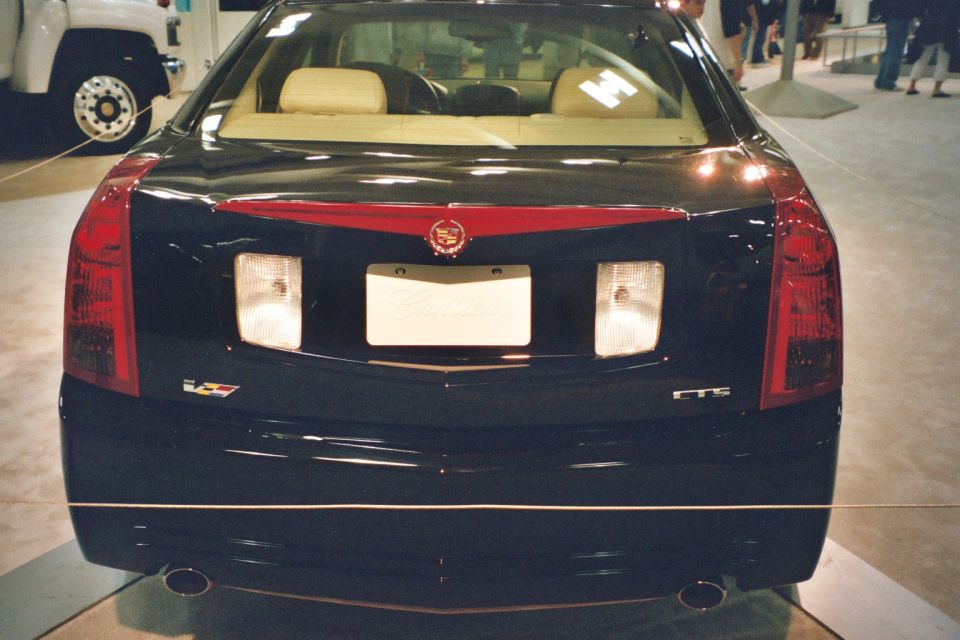 Cadillac CTS rear view, showing taillights, license plate area, and CTS badge