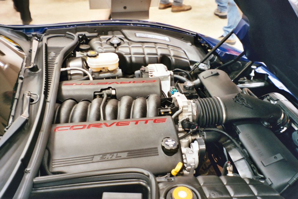 Corvette engine bay with 'CORVETTE' and '5.7L' visible on intake manifold