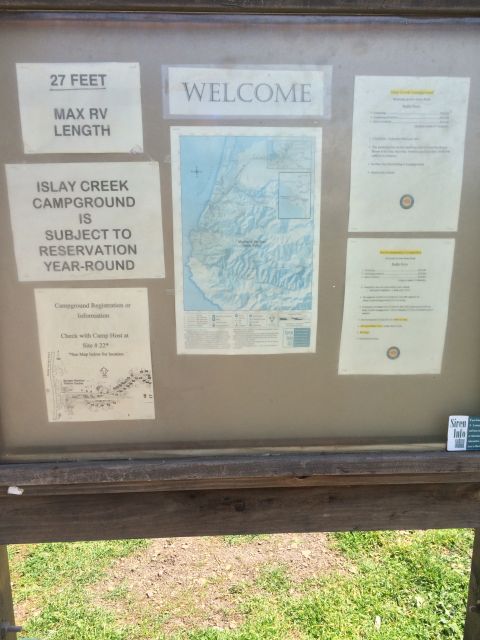 1996 Ford C-350 (Centurion Conversions) - Information board at Islay Creek Campground details RV length limits and reservation requirements.