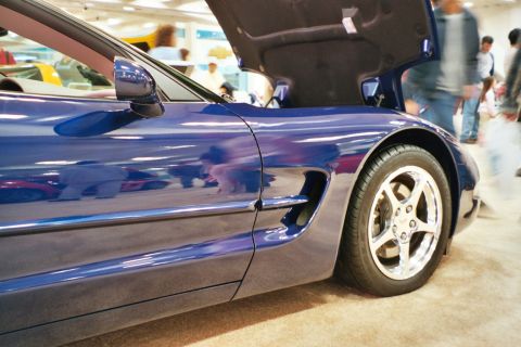 1992 Mercury Grand Marquis - A blue sports car is displayed with its hood open, revealing the engine bay.