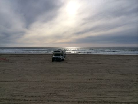 1996 Ford C-350 (Centurion Conversions) - Motorhome parked on the beach during an April camping trip.