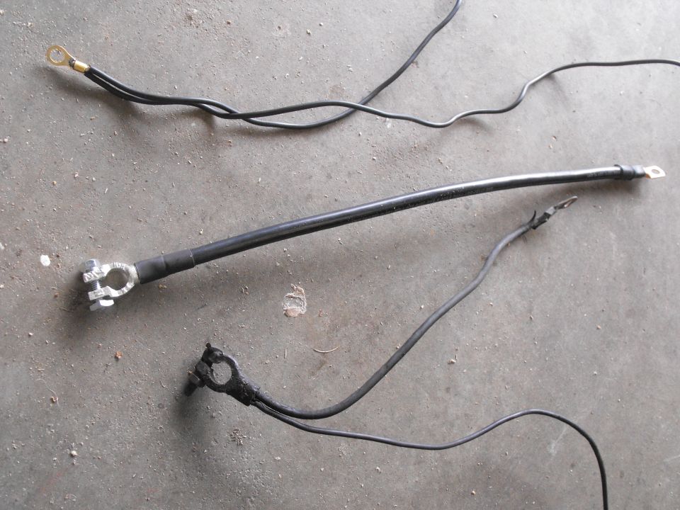 I made up the wire above the one gauge to go from fender body ground to cylinder head engine ground and carry on to the 120 amp Denso alternator's case stud ground. The old unit below looks pretty poor by comparison IMO.
