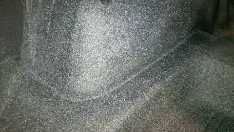 1963 Chevrolet Nova - The textured undercoating on the underside of a vehicle is visible in this close-up shot.