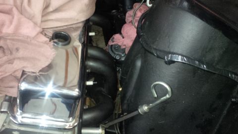 1963 Chevrolet Nova - Close-up of an engine bay with chrome valve cover and exhaust headers.