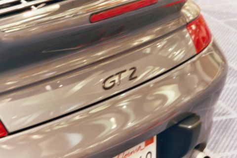 1992 Mercury Grand Marquis - Close-up of the rear badge on a silver Porsche GT2, indicating its model designation.