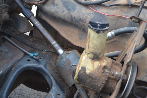 1981 Ford F-250 - Close-up of steering column and power steering reservoir, likely from an older truck.
