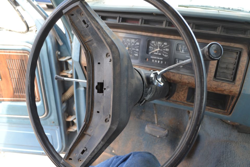Interior shot of a truck's dashboard with a steering wheel and gauges. The 1981 Ford F-250 label is inaccurate