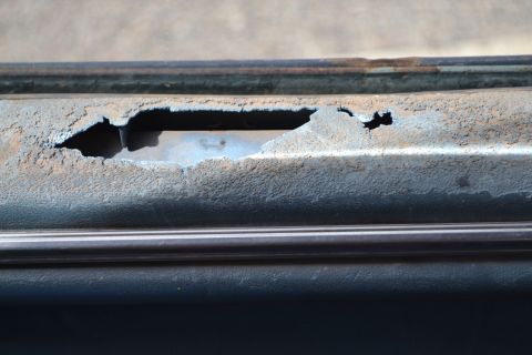 1981 Ford F-250 - Significant rust damage is visible on this vehicle's metal panel.