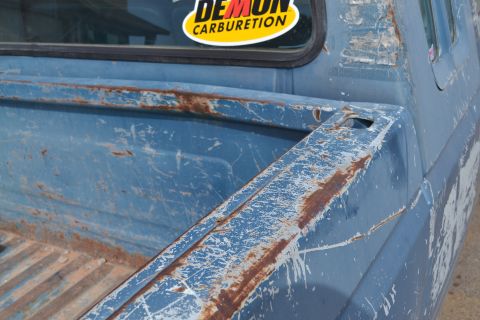 1981 Ford F-250 - The worn blue paint and visible rust on this truck bed suggest it is not a 1981 model.