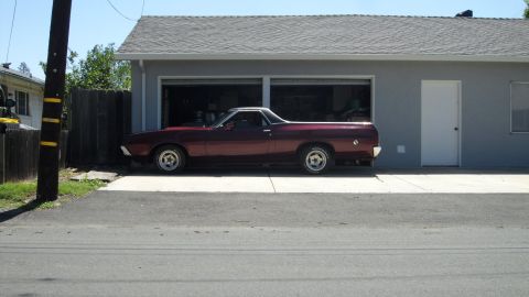 1972 Ford Ranchero - Maroon 1972 Ford Ranchero with a white roof parked in a driveway.