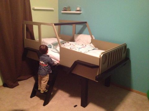 2005 Jeep Wrangler - A child's bed is designed to resemble a Jeep Wrangler, complete with a grille detail.