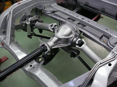 Rear differential and suspension on a bare frame, silver