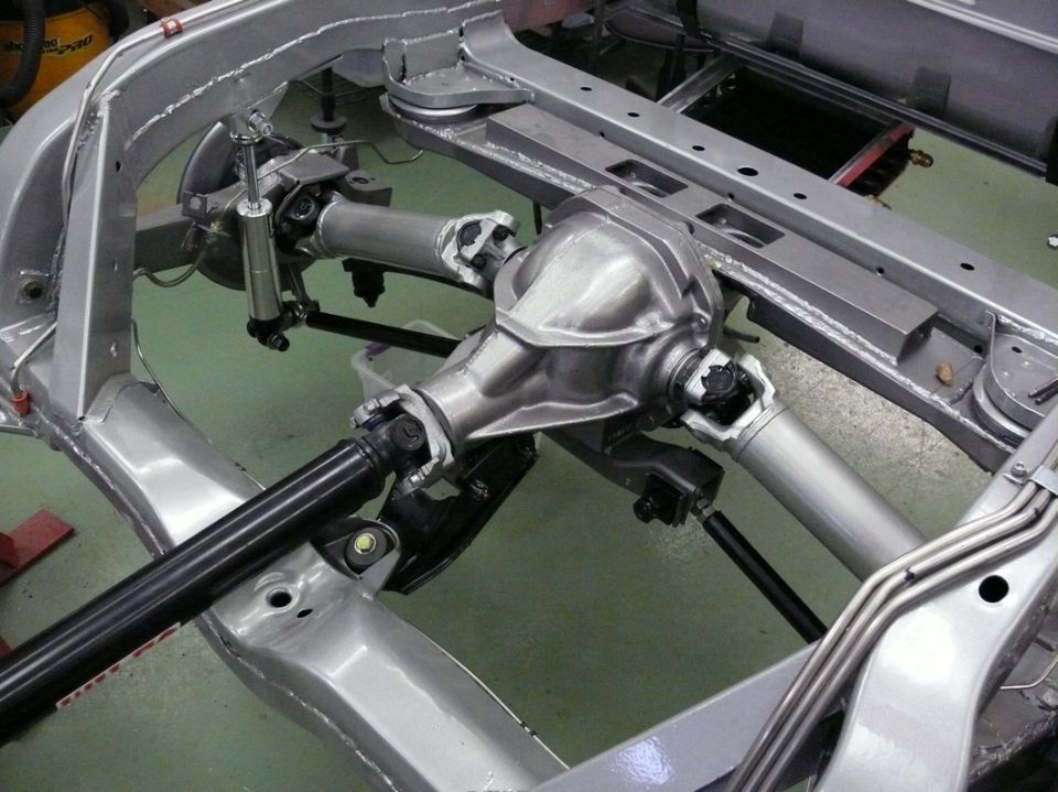 Rear differential and suspension on a bare frame, silver