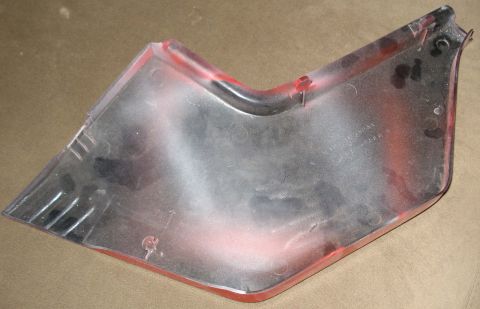 2008 Ford Crown Victoria - This automotive trim piece is red and clear plastic, showing signs of wear and a website address.