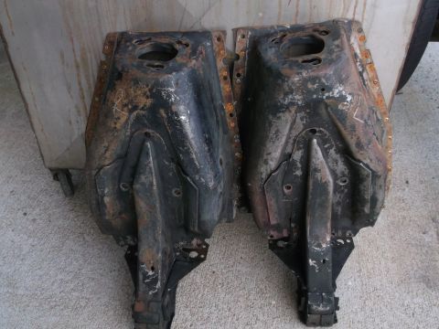 1971 Ford Ranchero - Two heavily rusted automotive subframe components are displayed side-by-side, showing signs of wear and age.