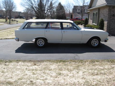 1966 Ford Falcon - This 1966 Ford Falcon station wagon is seen from the side, parked on a driveway.