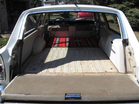 1966 Ford Falcon - Rear view of a 1966 Ford Falcon wagon's interior, showing the cargo space and seats.
