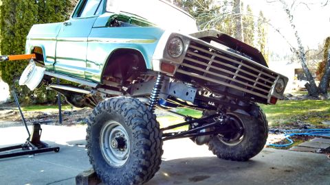 1967 Ford F-250 - This 1967 Ford F-250 is undergoing work, with its front end elevated for maintenance.