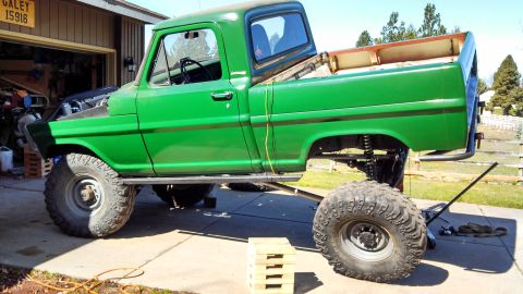 1967 Ford F-250 - This modified 1967 Ford F-250 pickup truck features a lifted suspension and oversized off-road tires.
