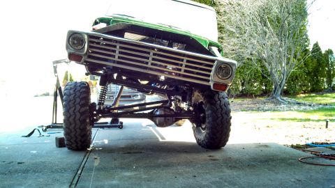 1967 Ford F-250 - Front view of a 1967 Ford F-250 modified for off-roading, showing its lifted suspension and large tires.