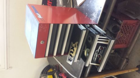 1996 Ford Bronco - Tool chest with Fox Racing stickers and open drawers containing parts.
