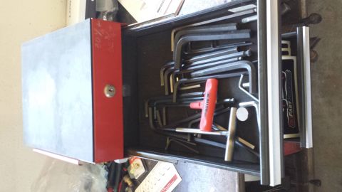1996 Ford Bronco - A red and silver tool drawer is open, revealing a collection of hex keys and other tools.