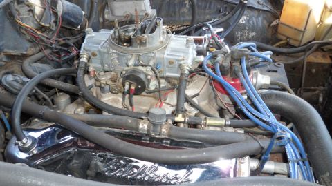 1972 Ford Ranchero - The engine bay shows a carburetor, distributor, and various hoses and wires.