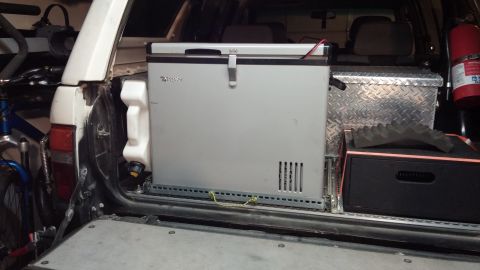 1985 Toyota 4Runner - The rear interior of a 1985 Toyota 4Runner is equipped with a portable refrigerator and other camping gear.